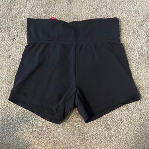 Grey and pink spandex shorts.